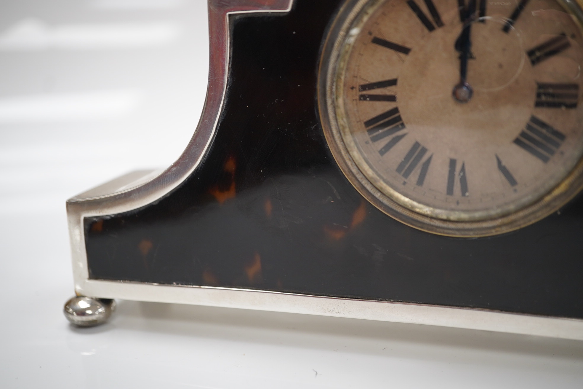 A George V silver and tortoiseshell mounted mantel timepiece, on bun feet, Horton & Allday, Birmingham, 1920, 20.6cm width. Condition - fair to good (not currently running).